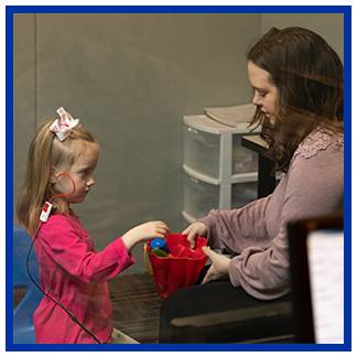 Student working with a pediatric standardized patient.